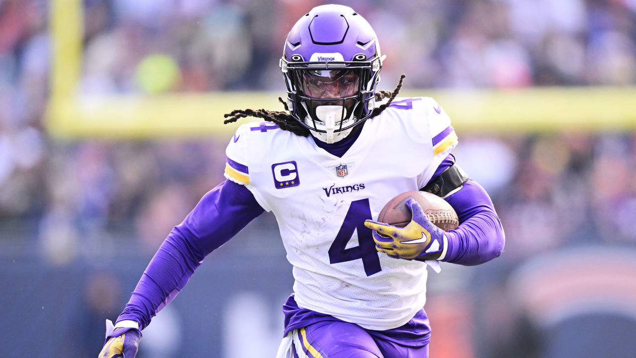 CHICAGO, ILLINOIS - JANUARY 08: Running back Dalvin Cook #4 of the Minnesota Vikings carries the ball during the game against the Chicago Bears at Soldier Field on January 08, 2023 in Chicago, Illinois.