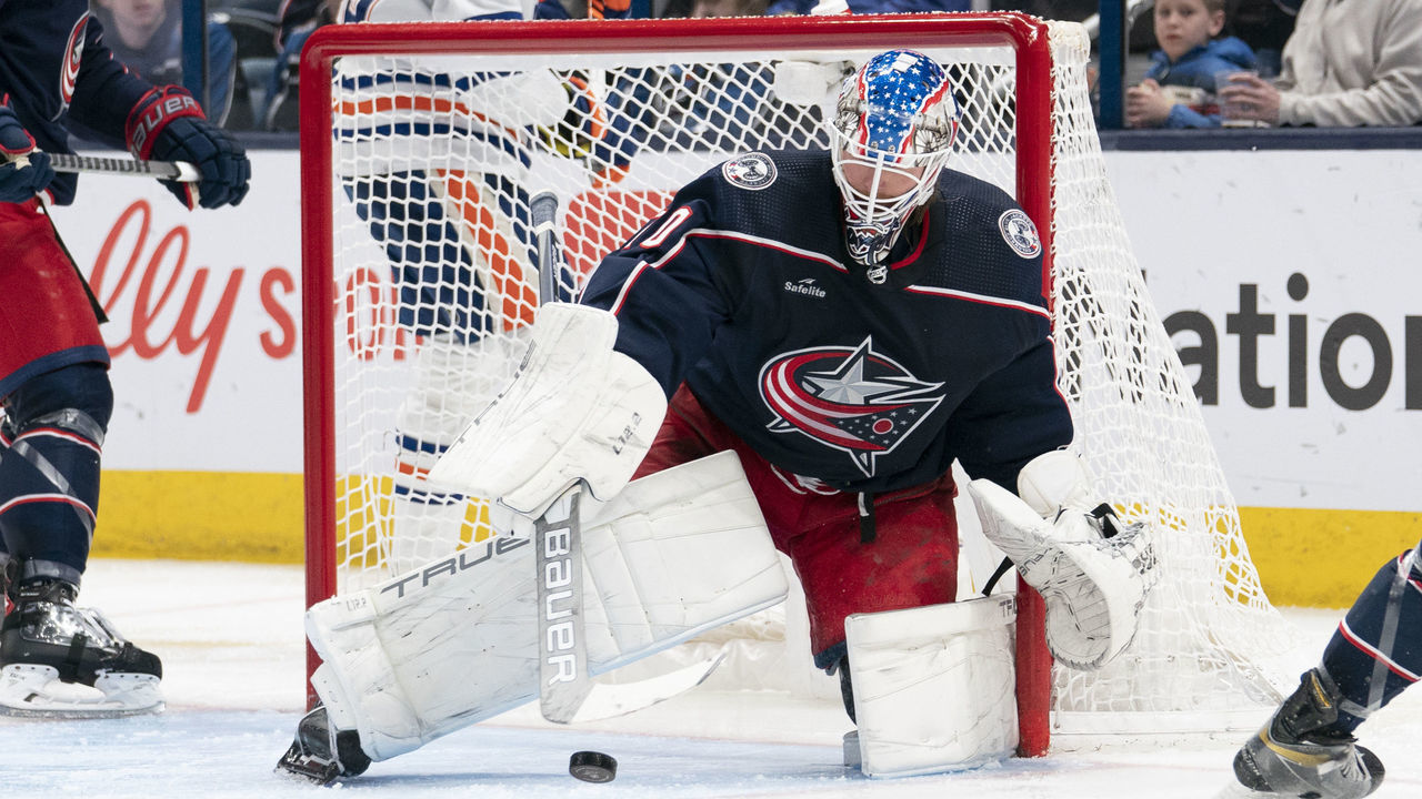 COLUMBUS, OH - FEBRUARY 25: Columbus Blue Jackets goaltender Joonas Korpisalo #70 deflects the puck during the game between the Columbus Blue Jackets and the Edmonton Oilers at Nationwide Arena in Columbus, Ohio on February 25, 2023.
