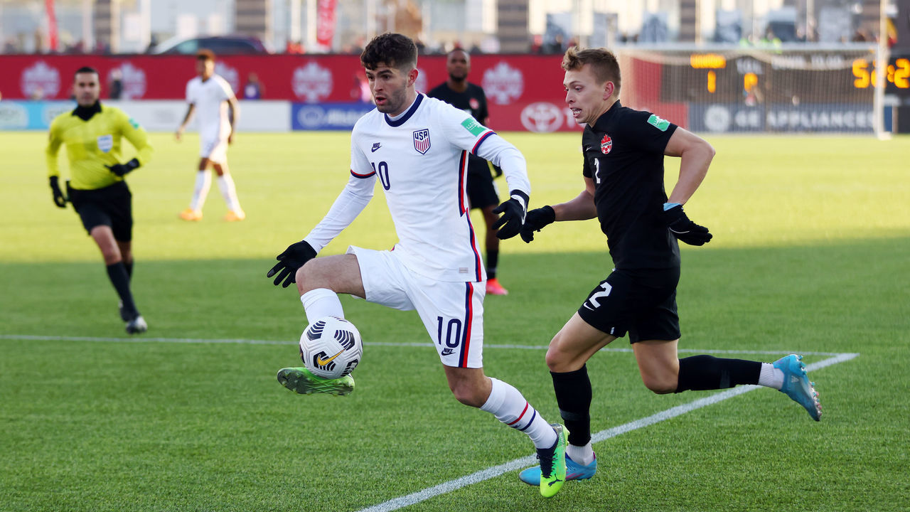 HAMILTON, ON - JANUARY 30: Alistair Johnston #2 of Canada and Christian Pulisic #10 of the United States battle for the ball during a 2022 World Cup Qualifying match at Tim Hortons Field on January 30, 2022 in Hamilton, Ontario, Canada.