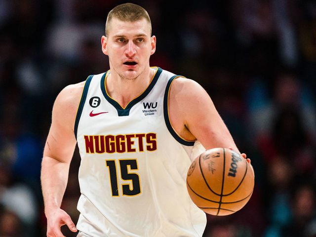 CHARLOTTE, NORTH CAROLINA - FEBRUARY 11: Nikola Jokic #15 of the Denver Nuggets brings the ball up court in the third quarter during their game against the Charlotte Hornets at Spectrum Center on February 11, 2023 in Charlotte, North Carolina.