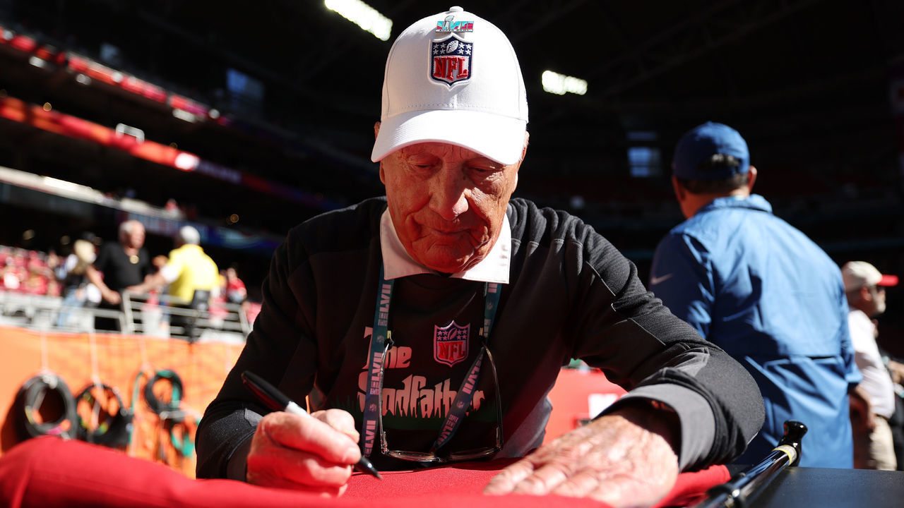 GLENDALE, ARIZONA - FEBRUARY 12: Groundskeeper George Toma signs an autograph before Super Bowl LVII between the Kansas City Chiefs and the Philadelphia Eagles at State Farm Stadium on February 12, 2023 in Glendale, Arizona.