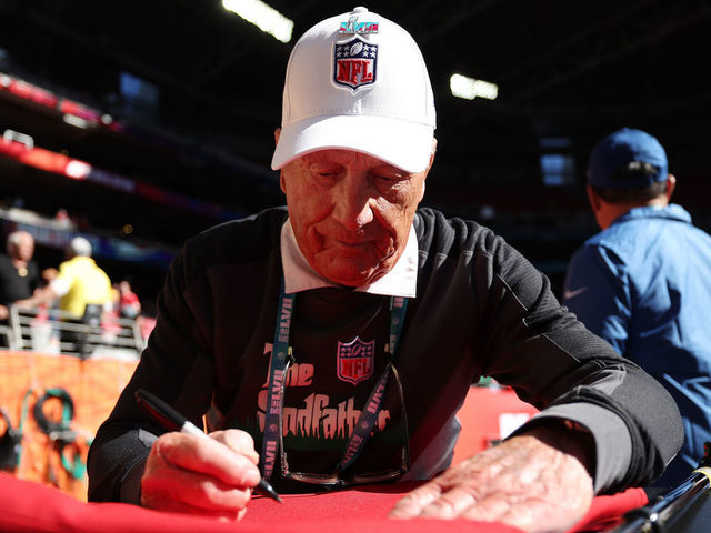 GLENDALE, ARIZONA - FEBRUARY 12: Groundskeeper George Toma signs an autograph before Super Bowl LVII between the Kansas City Chiefs and the Philadelphia Eagles at State Farm Stadium on February 12, 2023 in Glendale, Arizona.