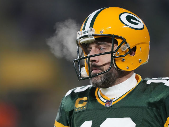 GREEN BAY, WISCONSIN - JANUARY 08: Aaron Rodgers #12 of the Green Bay Packers warms up before a game against the Detroit Lions at Lambeau Field on January 08, 2023 in Green Bay, Wisconsin.