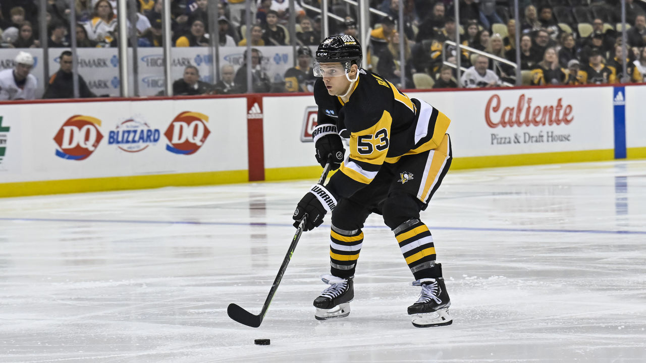 PITTSBURGH, PA - FEBRUARY 20: Pittsburgh Penguins Center Teddy Blueger (53) skates with the puck during the third period in the NHL game between the Pittsburgh Penguins and the New York Islanders on February 20, 2023, at PPG Paints Arena in Pittsburgh, PA.