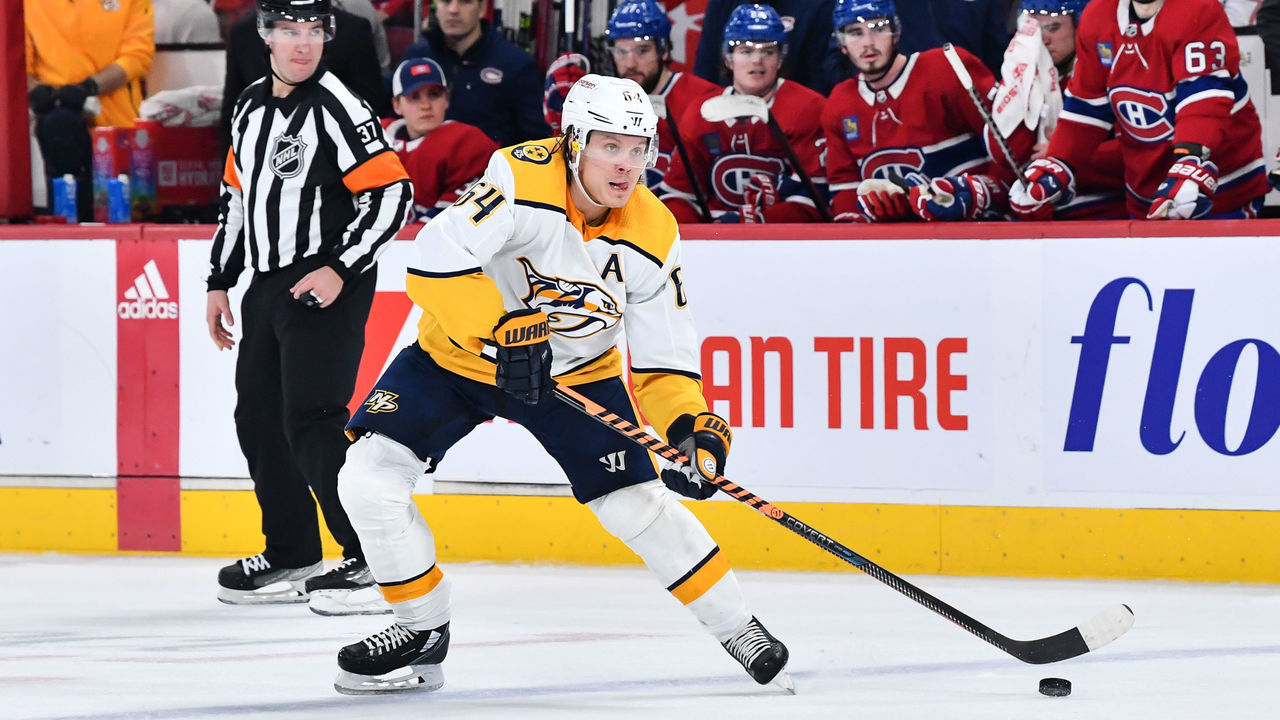 MONTREAL, CANADA - JANUARY 12: Mikael Granlund #64 of the Nashville Predators looks to play the puck during the third period against the Montreal Canadiens at Centre Bell on January 12, 2023 in Montreal, Quebec, Canada. The Montreal Canadiens defeated the Nashville Predators 4-3.