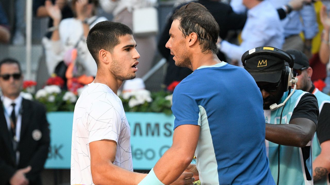 MADRID, SPAIN - MAY 06: Carlos Alcaraz greats Rafael Nadal during their match at the Mutua Madrid Open, on May 6, 2022, in Madrid, Spain.
