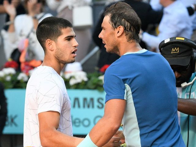 MADRID, SPAIN - MAY 06: Carlos Alcaraz greats Rafael Nadal during their match at the Mutua Madrid Open, on May 6, 2022, in Madrid, Spain.
