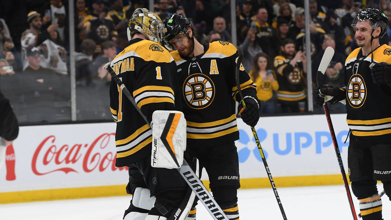 BOSTON, MASSACHUSETTS - MARCH 2: Jeremy Swayman #1 and David Pastrnak #88 of the Boston Bruins celebrate the win against the Buffalo Sabres at the TD Garden on March 2, 2023 in Boston, Massachusetts.