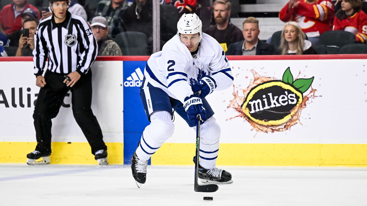 CALGARY, AB - MARCH 02: Toronto Maple Leafs Defenceman Luke Schenn (2) plays the puck during the first period of an NHL game between the Calgary Flames and the Toronto Maple Leafs on March 2, 2023, at the Scotiabank Saddledome in Calgary, AB.