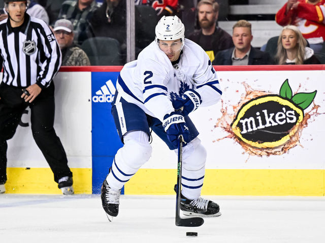 CALGARY, AB - MARCH 02: Toronto Maple Leafs Defenceman Luke Schenn (2) plays the puck during the first period of an NHL game between the Calgary Flames and the Toronto Maple Leafs on March 2, 2023, at the Scotiabank Saddledome in Calgary, AB.