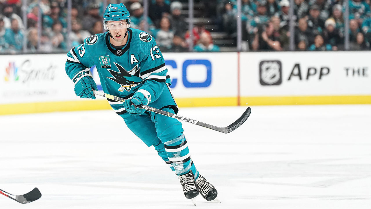 SAN JOSE, CA - FEBRUARY 25: Nick Bonino #13 of the San Jose Sharks passes the puck against the Chicago Blackhawks at SAP Center on February 25, 2023 in San Jose, California.