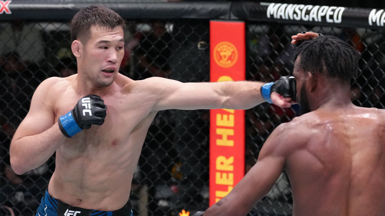 LAS VEGAS, NEVADA - JUNE 25: (L-R) Shavkat Rakhmonov of Uzbekistan punches Neil Magny in a welterweight fight during the UFC Fight Night event at UFC APEX on June 25, 2022 in Las Vegas, Nevada.