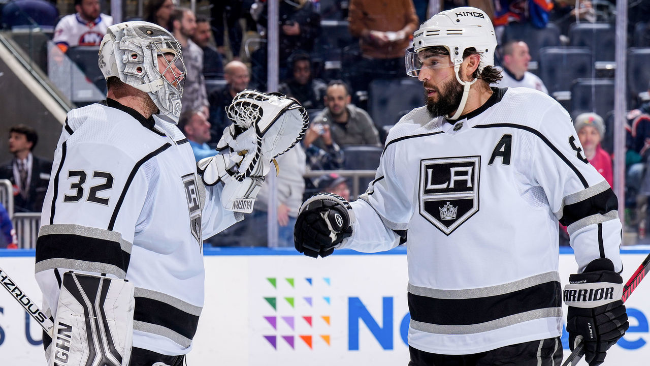 ELMONT, NEW YORK - FEBRUARY 24: Jonathan Quick #32 and Drew Doughty #8 of the Los Angeles Kings celebrate the 3-2 win against the New York Islanders at UBS Arena on February 24, 2023 in Elmont, New York.