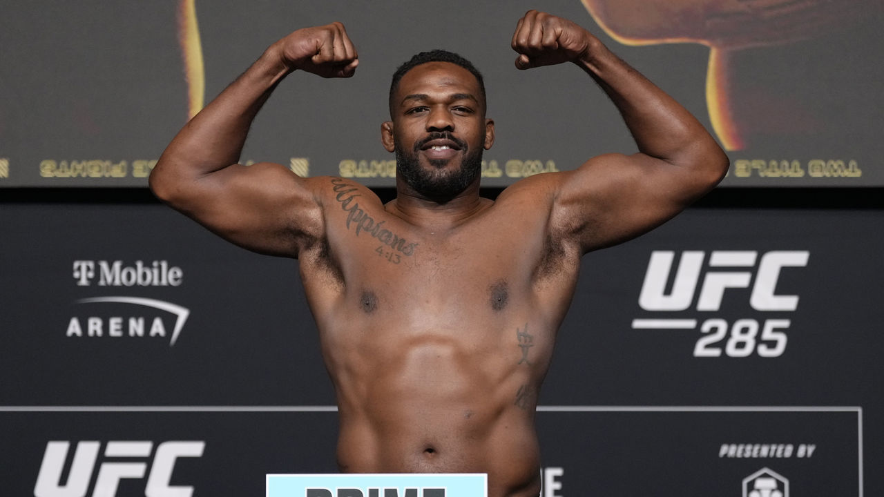LAS VEGAS, NEVADA - MARCH 03: Jon Jones poses on the scale during the UFC 285 official weigh-in at UFC APEX on March 03, 2023 in Las Vegas, Nevada.