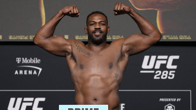 LAS VEGAS, NEVADA - MARCH 03: Jon Jones poses on the scale during the UFC 285 official weigh-in at UFC APEX on March 03, 2023 in Las Vegas, Nevada.