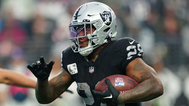 LAS VEGAS, NEVADA - DECEMBER 18: Josh Jacobs #28 of the Las Vegas Raiders runs with the ball during the third quarter against the New England Patriots at Allegiant Stadium on December 18, 2022 in Las Vegas, Nevada.