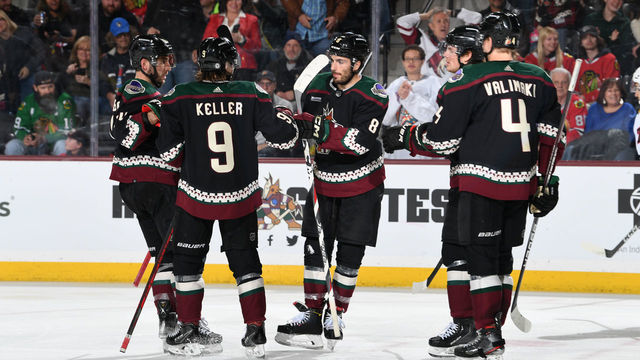 TEMPE, ARIZONA - FEBRUARY 28: Nick Schmaltz #8 of the Arizona Coyotes celebrates with Shayne Gostisbehere #14, Clayton Keller #9 and teammates after scoring a goal against the Chicago Blackhawks during the third period at Mullett Arena on February 28, 2023 in Tempe, Arizona.