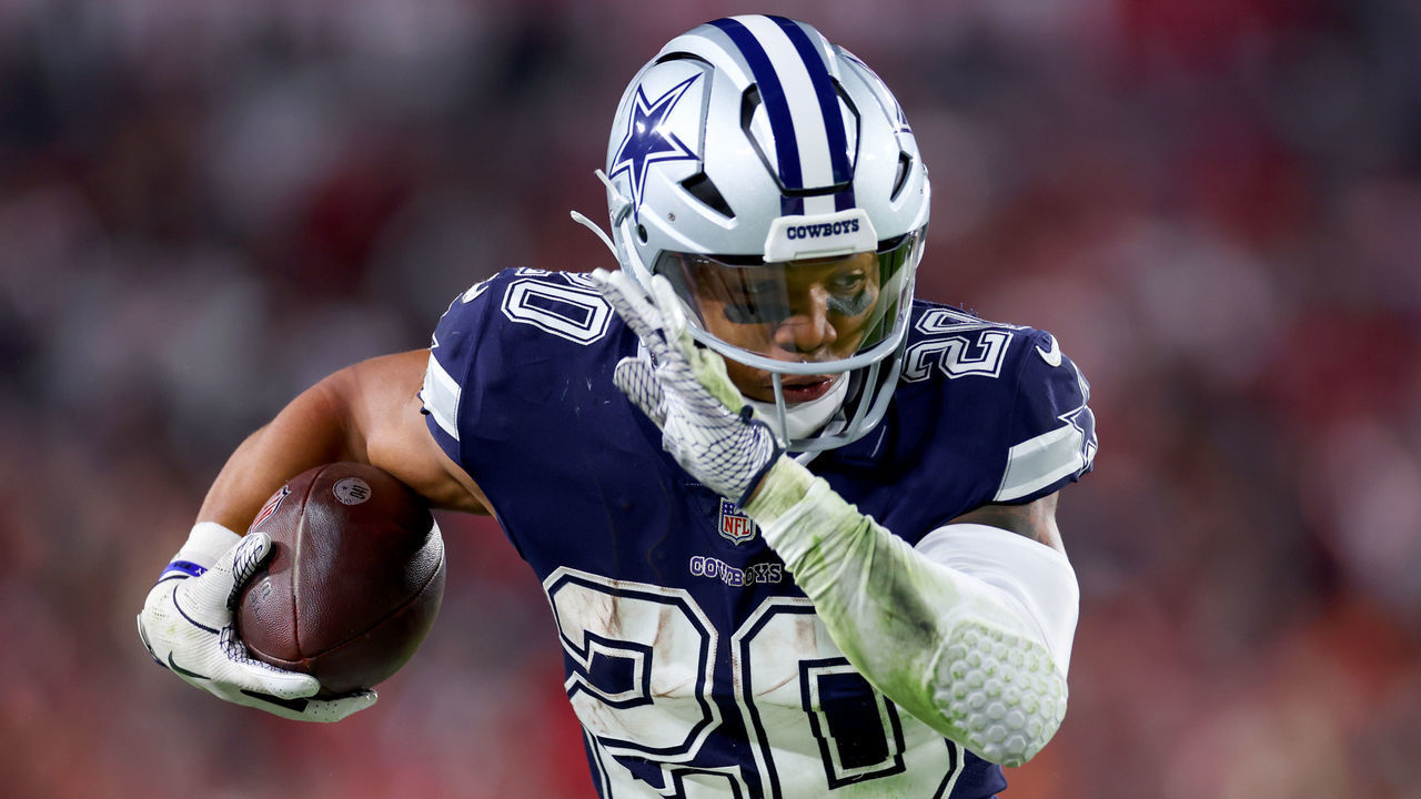 TAMPA, FLORIDA - JANUARY 16: Tony Pollard #20 of the Dallas Cowboys carries the ball against the Tampa Bay Buccaneers during the third quarter in the NFC Wild Card playoff game at Raymond James Stadium on January 16, 2023 in Tampa, Florida.