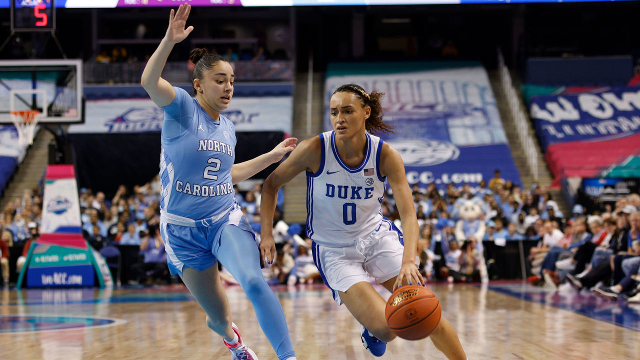 GREENSBORO, NC - MARCH 03: Celeste Taylor #0 of the Duke Blue Devils dribbles the ball against Paulina Paris #2 of the North Carolina Tar Heels during the second half of their game in the quarterfinals of the ACC Women's Basketball Tournament at Greensboro Coliseum on March 3, 2023 in Greensboro, North Carolina. Duke won 44-40.