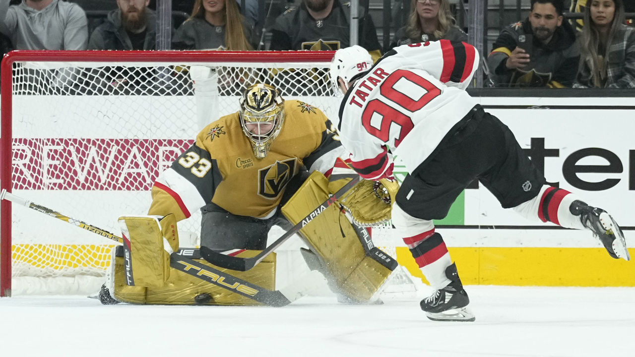 LAS VEGAS, NEVADA - MARCH 03: Adin Hill #33 of the Vegas Golden Knights makes a save against Tomas Tatar #90 of the New Jersey Devils in a shoot out at T-Mobile Arena on March 03, 2023 in Las Vegas, Nevada.