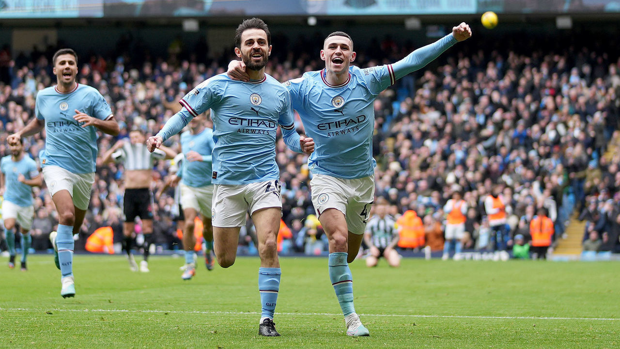 MANCHESTER, ENGLAND - MARCH 04: Bernardo Silva of Manchester City celebrates with teammate Phil Foden after scoring the team's second goal during the Premier League match between Manchester City and Newcastle United at Etihad Stadium on March 04, 2023 in Manchester, England.