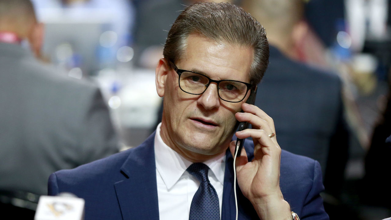 MONTREAL, QUEBEC - JULY 08: General manager Ron Hextall of the Pittsburgh Penguins talks on his phone at the draft table during the first round of the 2022 Upper Deck NHL Draft at Bell Centre on July 07, 2022 in Montreal, Quebec.