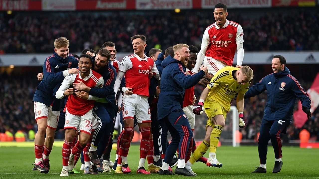 Arsenal's English midfielder Reiss Nelson (L) celebrates after scoring his team third goal of the team during the English Premier League football match between Arsenal and Bournemouth at the Emirates Stadium in London on March 4, 2023.