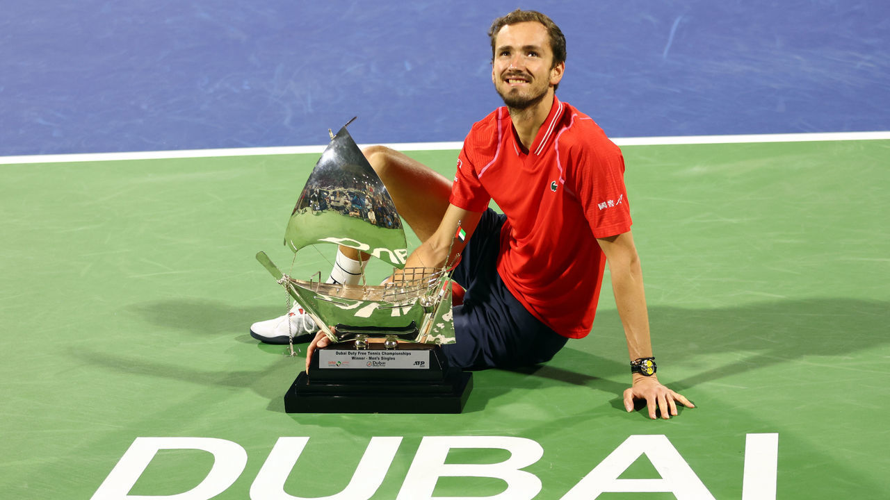 DUBAI, UNITED ARAB EMIRATES - MARCH 04: Daniil Medvedev celebrates with his winners trophy after the Men's Final Single's match on on day fourteen of the Dubai Duty Free Tennis at Dubai Duty Free Tennis Stadium on March 04, 2023 in Dubai, United Arab Emirates.
