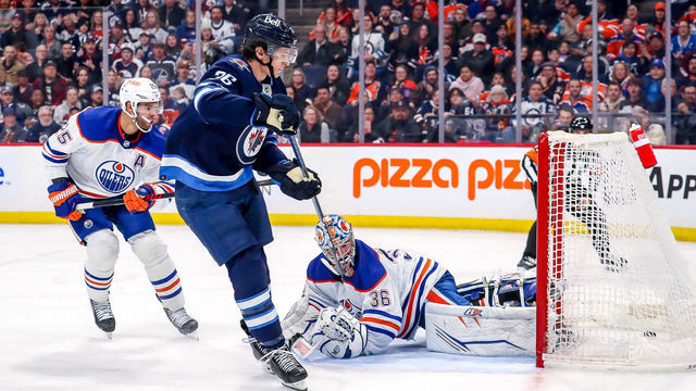 WINNIPEG, CANADA - MARCH 4: Morgan Barron #36 of the Winnipeg Jets scores on goaltender Jack Campbell #36 of the Edmonton Oilers for a second period goal at the Canada Life Centre on March 4, 2023 in Winnipeg, Manitoba, Canada.