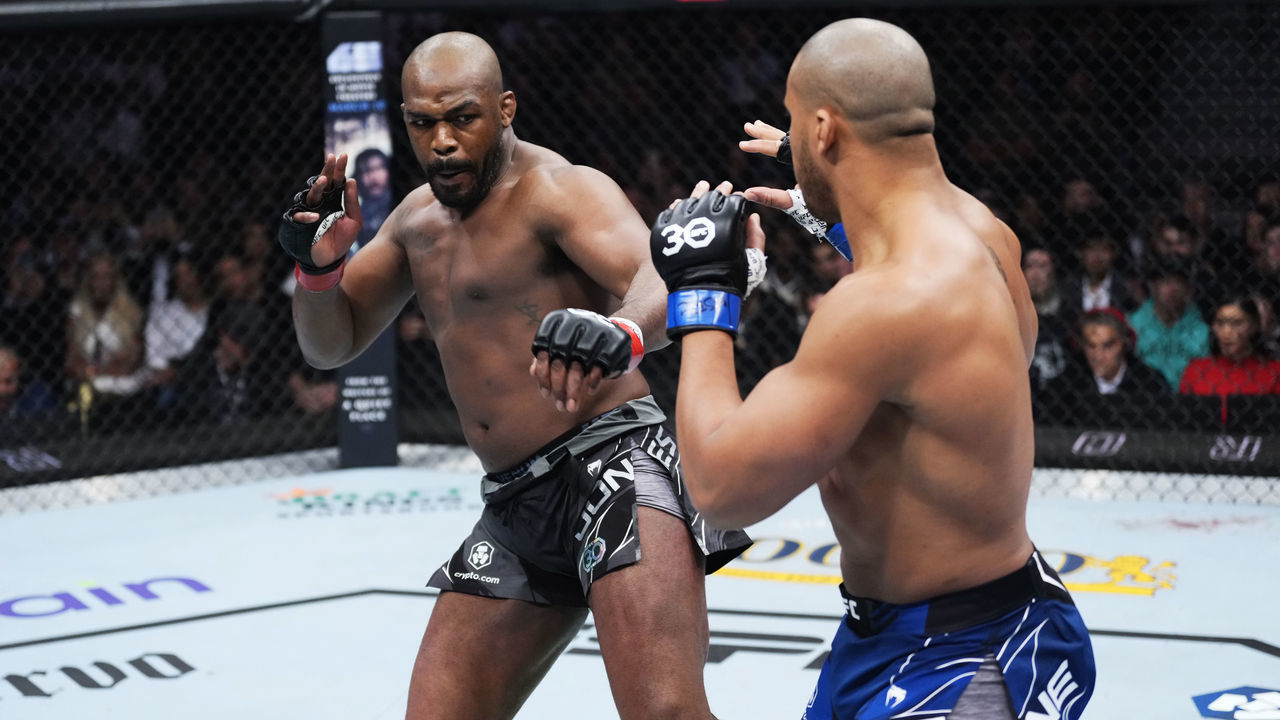 LAS VEGAS, NEVADA - MARCH 04: (L-R) Jon Jones kicks Ciryl Gane of France in the UFC heavyweight championship fight during the UFC 285 event at T-Mobile Arena on March 04, 2023 in Las Vegas, Nevada.