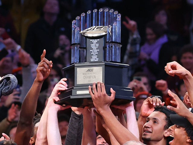 BROOKLYN, NY - MARCH 12: Virginia Tech Hokies hold up the championship trophy after winning the ACC Tournament final college basketball game between the Duke Blue Devils and the Virginia Tech Hokies on March 12, 2022, at the Barclays Center in Brooklyn, New York.