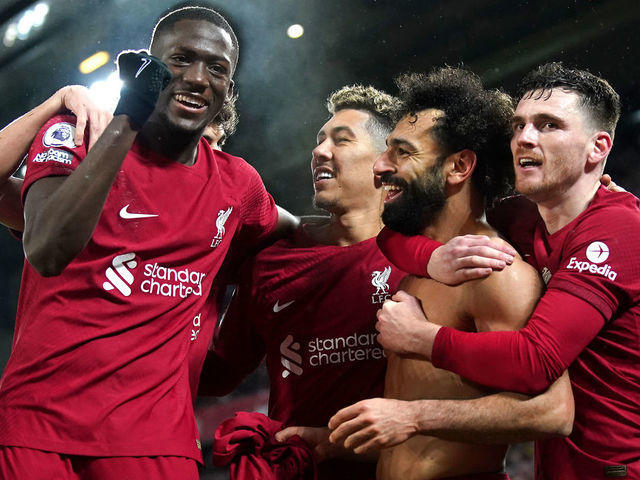 Liverpool's Mohamed Salah (second right) celebrates scoring their side's sixth goal of the game with team-mates during the Premier League match at Anfield, Liverpool. Picture date: Sunday March 5, 2023.