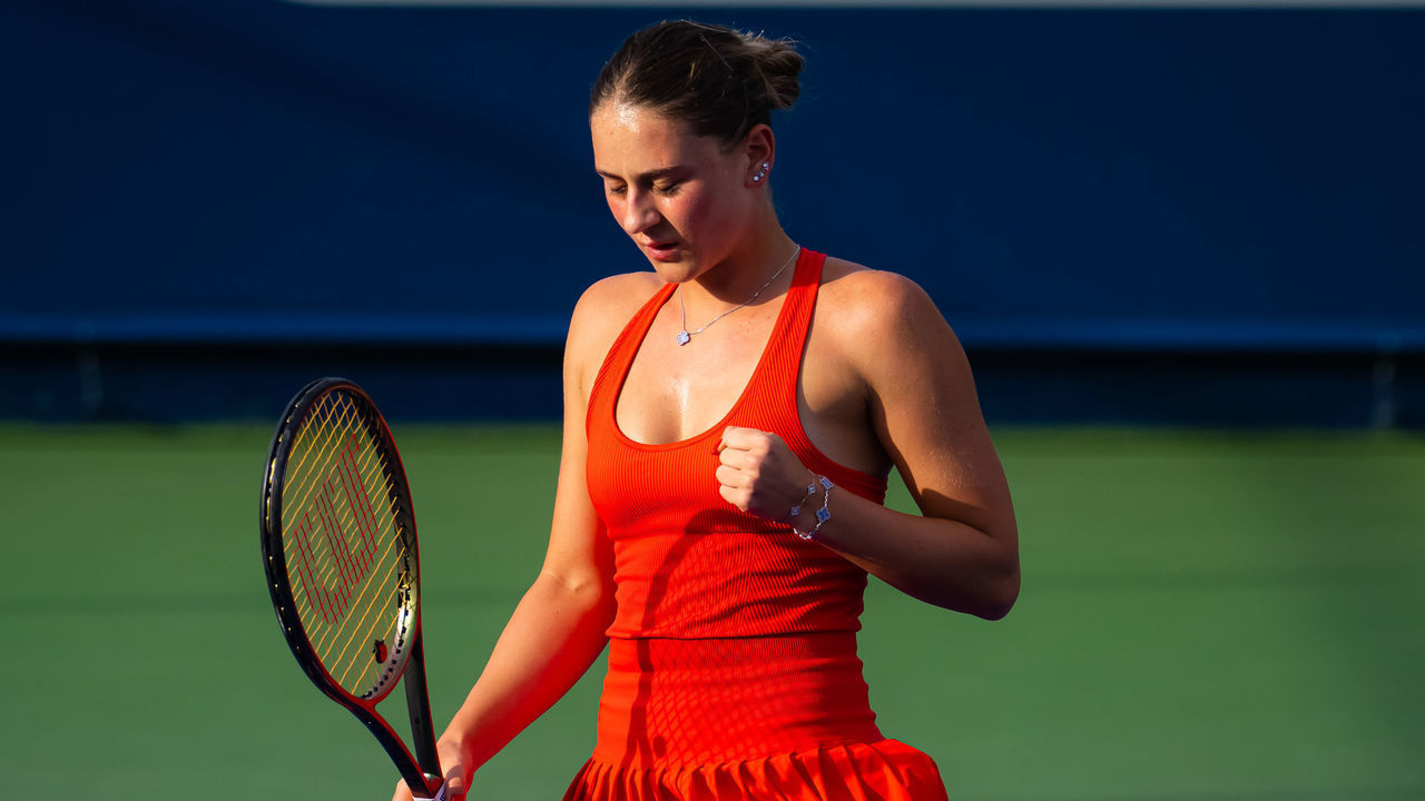 DUBAI, UNITED ARAB EMIRATES - FEBRUARY 21: Marta Kostyuk of Ukraine in action against Belinda Bencic of Switzerland during her second round match on Day 3 of the Dubai Duty Free Tennis at Dubai Duty Free Tennis Stadium on February 21, 2023 in Dubai, United Arab Emirates