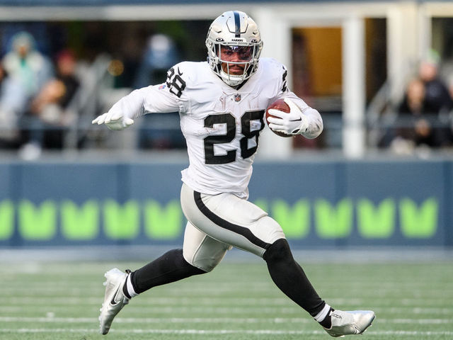 SEATTLE, WASHINGTON - NOVEMBER 27: Josh Jacobs #28 of the Las Vegas Raiders carries the ball during the second quarter of the game against the Seattle Seahawks at Lumen Field on November 27, 2022 in Seattle, Washington.
