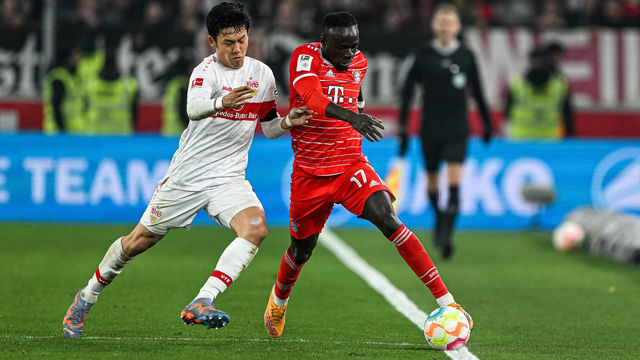 STUTTGART, GERMANY - MARCH 04: Wataru Endo of VfB Stuttgart and Sadio Mane of Bayern Muenchen battle for the ball during the Bundesliga match between VfB Stuttgart and FC Bayern München at Mercedes-Benz Arena on March 4, 2023 in Stuttgart, Germany.