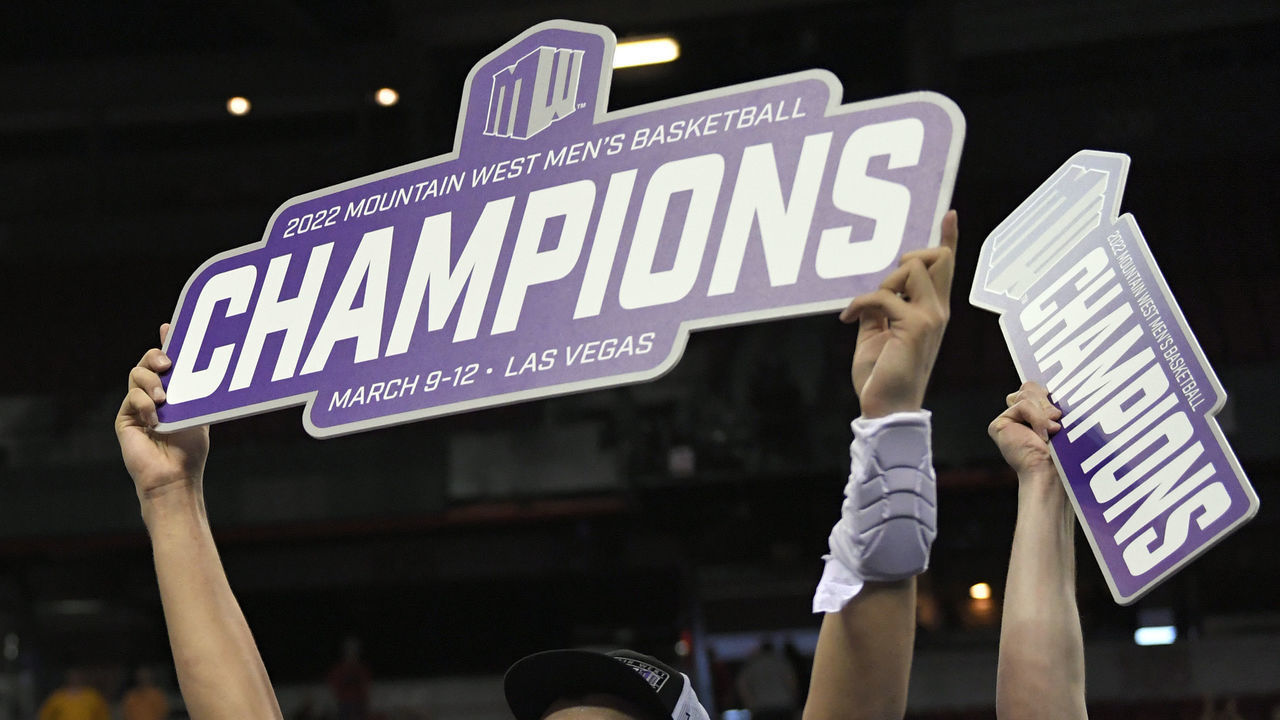 LAS VEGAS, NEVADA - MARCH 12: The Boise State Broncos, including Tyson Degenhart (R) #2, celebrate their 53-52 victory over the San Diego State Aztecs to win the championship game of the Mountain West Conference basketball tournament at the Thomas & Mack Center on March 12, 2022 in Las Vegas, Nevada.