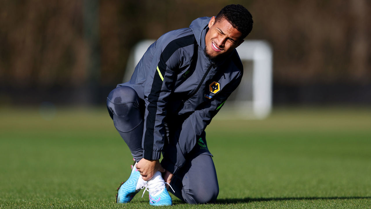 WOLVERHAMPTON, ENGLAND - FEBRUARY 13: Joao Gomes of Wolverhampton Wanderers adjusts his boots during a Wolverhampton Wanderers Training Session at The Sir Jack Hayward Training Ground on February 13, 2023 in Wolverhampton, England.