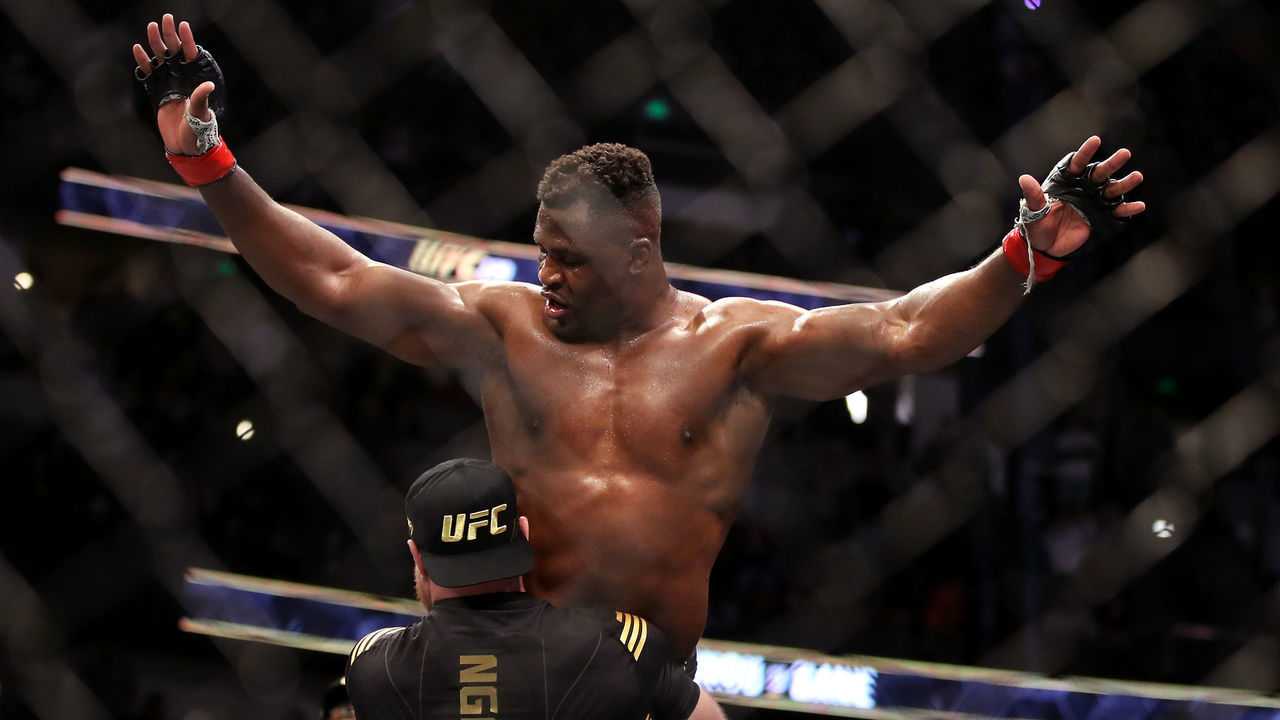 ANAHEIM, CALIFORNIA - JANUARY 22: Francis Ngannou of Cameroon celebrates with his team after defeating Ciryl Gane of France in their heavyweight title fight during the UFC 270 event at Honda Center on January 22, 2022 in Anaheim, California.