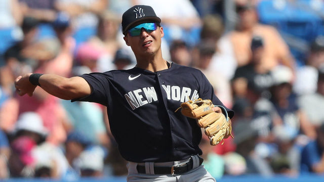DUNEDIN, FL - FEBRUARY 26: New York Yankees infielder Anthony Volpe (77) throws the ball over to first base during the spring training game between the New York Yankees and the Toronto Blue Jays on February 26, 2023, at the TD Ballpark in Dunedin, FL.