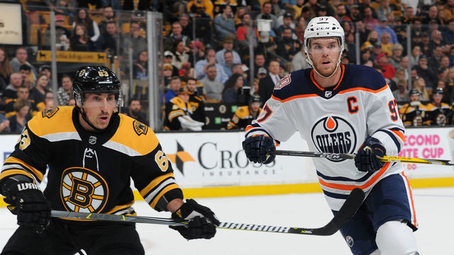 BOSTON, MA - OCTOBER 11: Brad Marchand #63 of the Boston Bruins against Connor McDavid #97 of the Edmonton Oilers at the TD Garden on October 11, 2018 in Boston, Massachusetts.