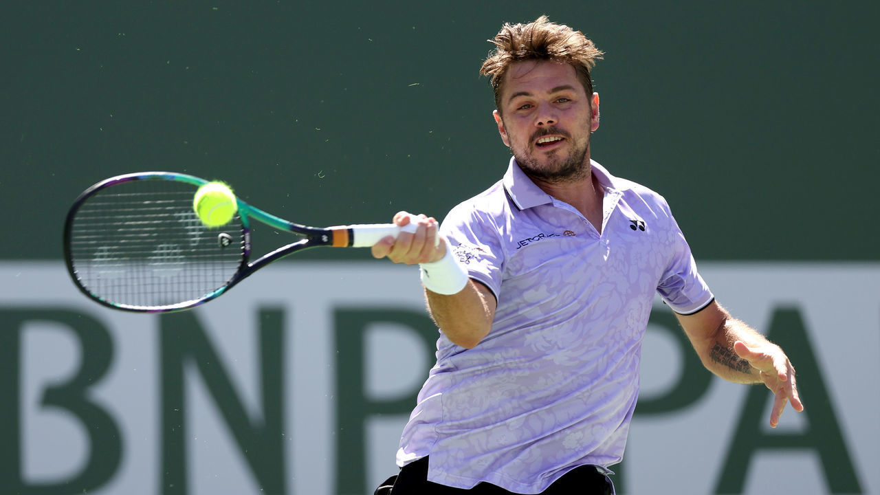 INDIAN WELLS, CALIFORNIA - MARCH 09: Stan Wawrinka of Switzerland returns a shot to Alexsandar Vukic of Australia during the BNP Paribas Open at the Indian Wells Tennis Garden on March 09, 2023 in Indian Wells, California.