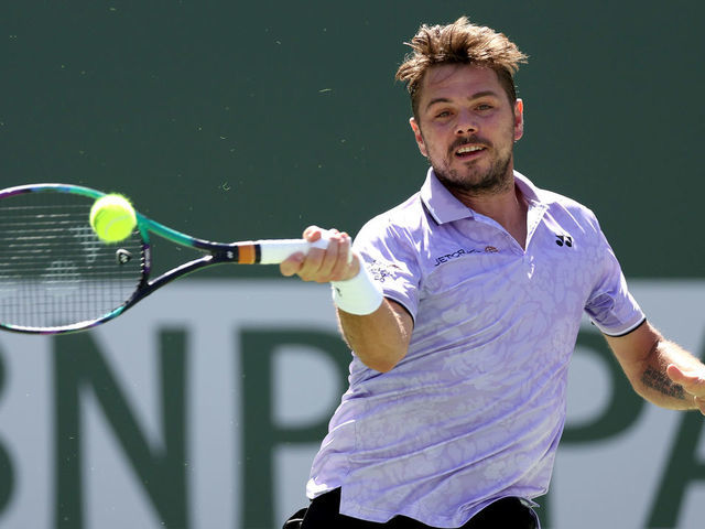 INDIAN WELLS, CALIFORNIA - MARCH 09: Stan Wawrinka of Switzerland returns a shot to Alexsandar Vukic of Australia during the BNP Paribas Open at the Indian Wells Tennis Garden on March 09, 2023 in Indian Wells, California.