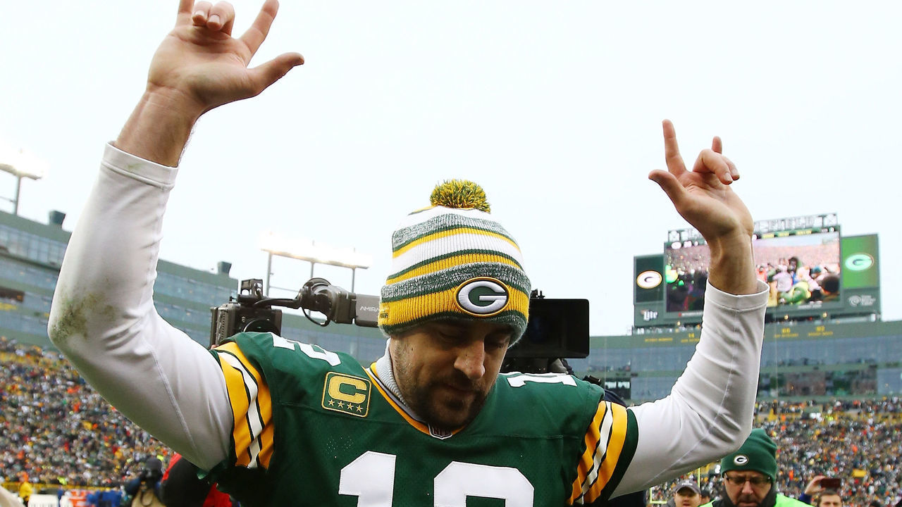 GREEN BAY, WI - JANUARY 11: Aaron Rodgers #12 of the Green Bay Packers celebrates after defeating the Dallas Cowboys 26-21 during the 2015 NFC Divisional Playoff game at Lambeau Field on January 11, 2015 in Green Bay, Wisconsin.