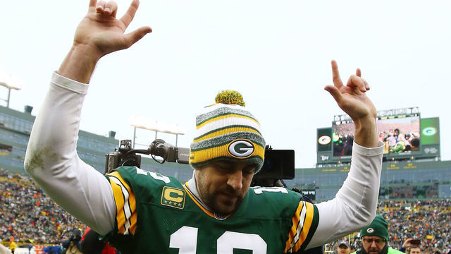 GREEN BAY, WI - JANUARY 11: Aaron Rodgers #12 of the Green Bay Packers celebrates after defeating the Dallas Cowboys 26-21 during the 2015 NFC Divisional Playoff game at Lambeau Field on January 11, 2015 in Green Bay, Wisconsin.