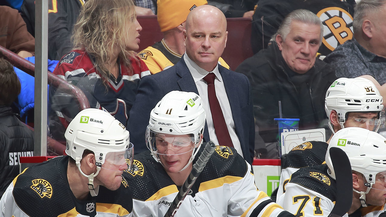 VANCOUVER, CANADA - FEBRUARY 25: Head coach Jim Montgomery of the Boston Bruins looks on from the bench during their NHL game against the Vancouver Canucks at Rogers Arena February 25, 2023 in Vancouver, British Columbia, Canada.