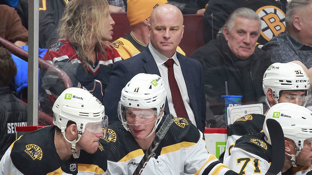 VANCOUVER, CANADA - FEBRUARY 25: Head coach Jim Montgomery of the Boston Bruins looks on from the bench during their NHL game against the Vancouver Canucks at Rogers Arena February 25, 2023 in Vancouver, British Columbia, Canada.