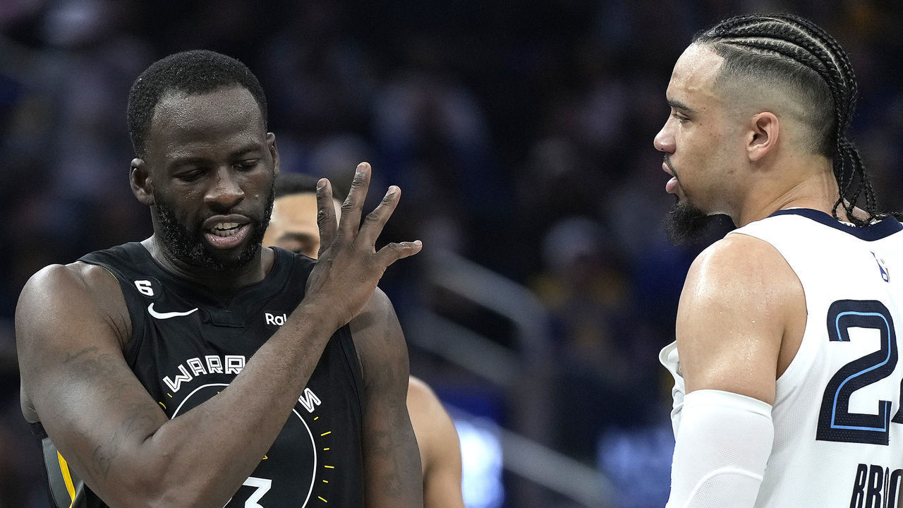 SAN FRANCISCO, CALIFORNIA - DECEMBER 25: Draymond Green #23 of the Golden State Warriors and Dillon Brooks #24 of the Memphis Grizzlies exchange word with each other during the second quarter at Chase Center on December 25, 2022 in San Francisco, California.
