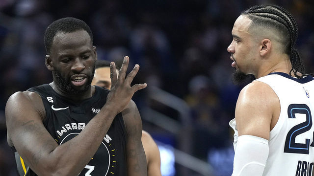 SAN FRANCISCO, CALIFORNIA - DECEMBER 25: Draymond Green #23 of the Golden State Warriors and Dillon Brooks #24 of the Memphis Grizzlies exchange word with each other during the second quarter at Chase Center on December 25, 2022 in San Francisco, California.