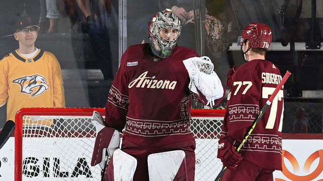 TEMPE, ARIZONA - MARCH 09: Ivan Prosvetov #50 of the Arizona Coyotes celebrates with teammate Victor Soderstrom #77 after a 4-1 win against the Nashville Predators at Mullett Arena on March 09, 2023 in Tempe, Arizona.