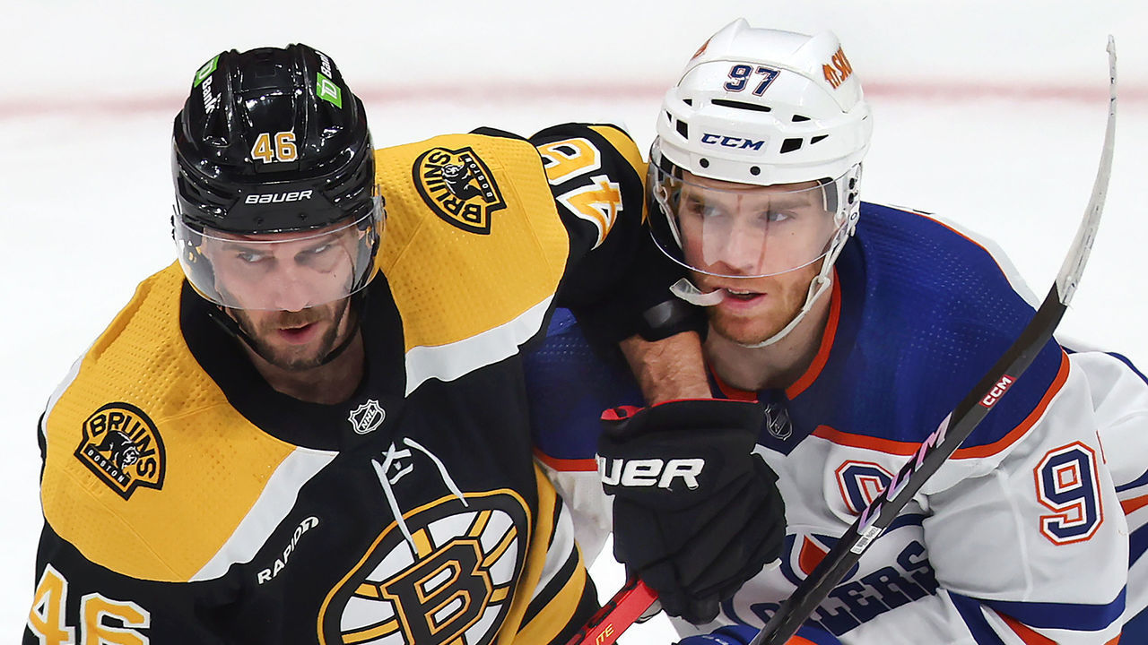 Boston, MA - March 9: Boston Bruins C David Krejci and Edmonton Oilers C Connor McDavid chase after a loose puck in the second period. The Bruins lost to the Oilers, 3-2.